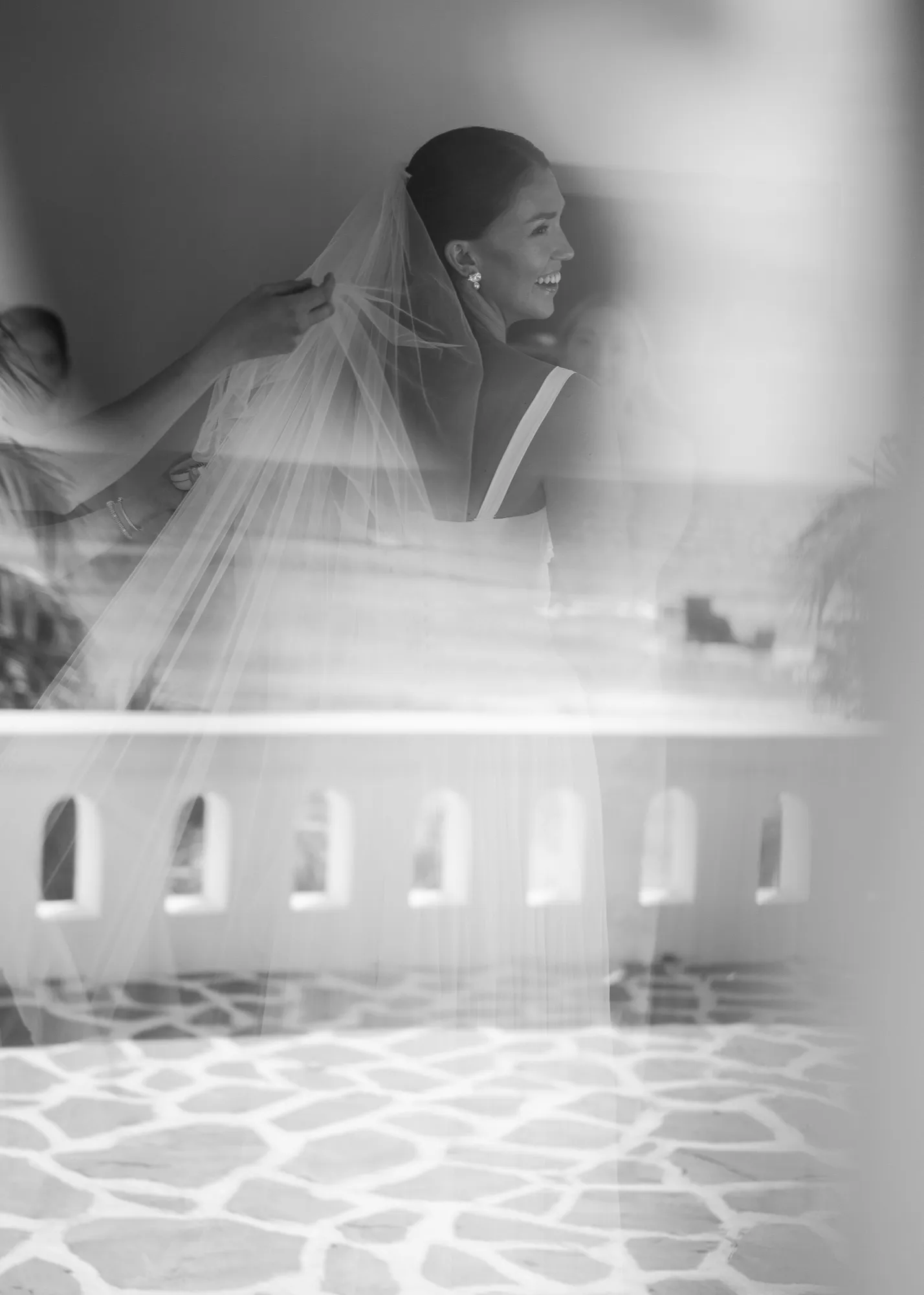 A bride in her veil getting ready, in black and white, at a Nosara wedding