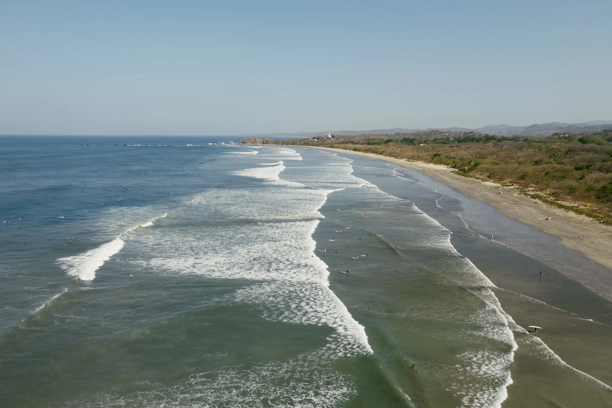 Aerial view of the long surf beach and jungle coastline at Nosara, Costa Rica